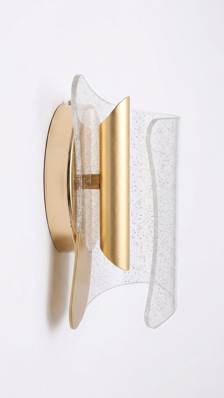 Glitter acrylic LED wall sconce with curved gold-toned center on white background from the side.