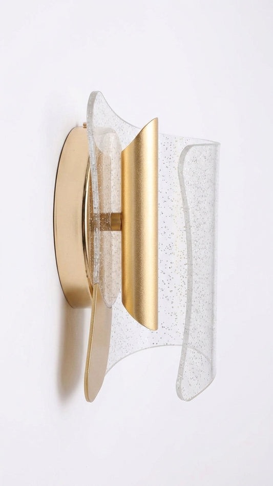 Glitter acrylic LED wall sconce with curved gold-toned center on white background from the side.