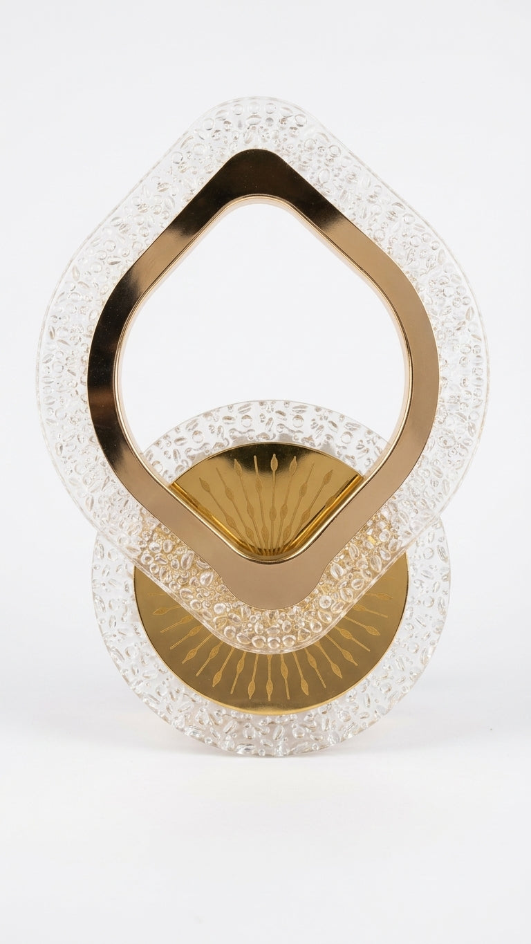 A decorative gold and clear textured glass sculpture on a seamless white background.